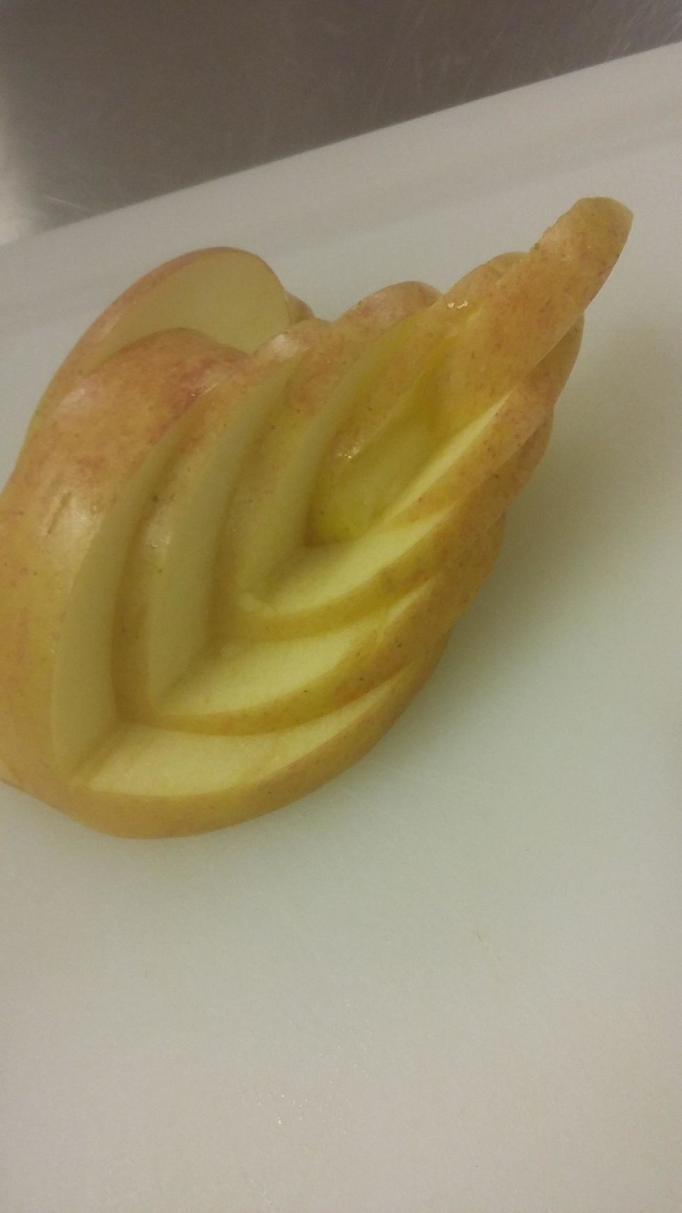 You should lay out the apple slices to look like this.