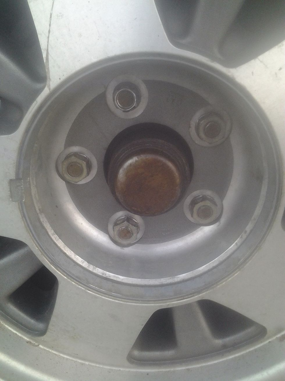 You should now be able to see the lug nuts.
