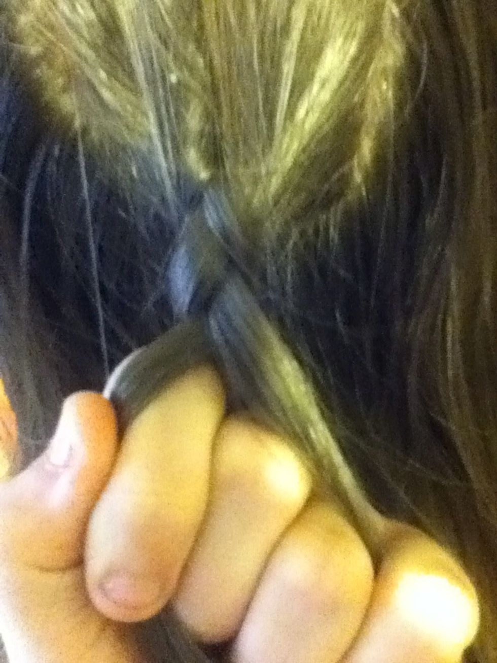 You should now be seeing the beginning of the braid, but you will start over and pull the first piece under the middle piece.