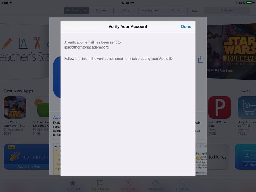 You should now see this screen, which prompts you to check your email on another nearby device. Login to the email address you used as your Apple ID and look for an email from Apple in your inbox.