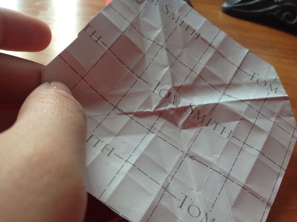 You should open it and be able to clearly see that diamond shape of your fold.