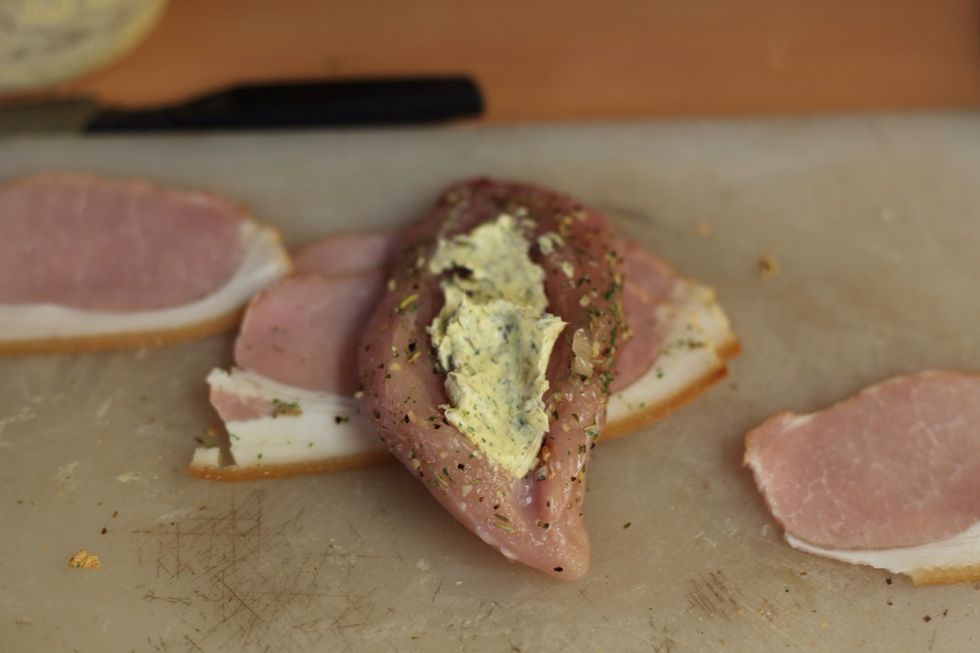 You should still have butter left over. If you don't, then you've over loaded the herb bread and you'll need to make more. Fill the chicken with the Tuscan herb butter mix.