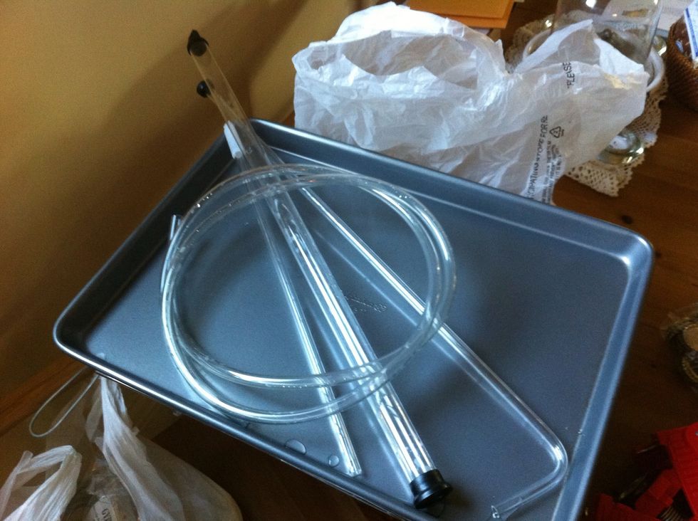 you still have that sanitization solution from the bottles. don't throw it out. it's still good. you can use it to wash your siphoning tools. let them sit in it for a half hour or so.