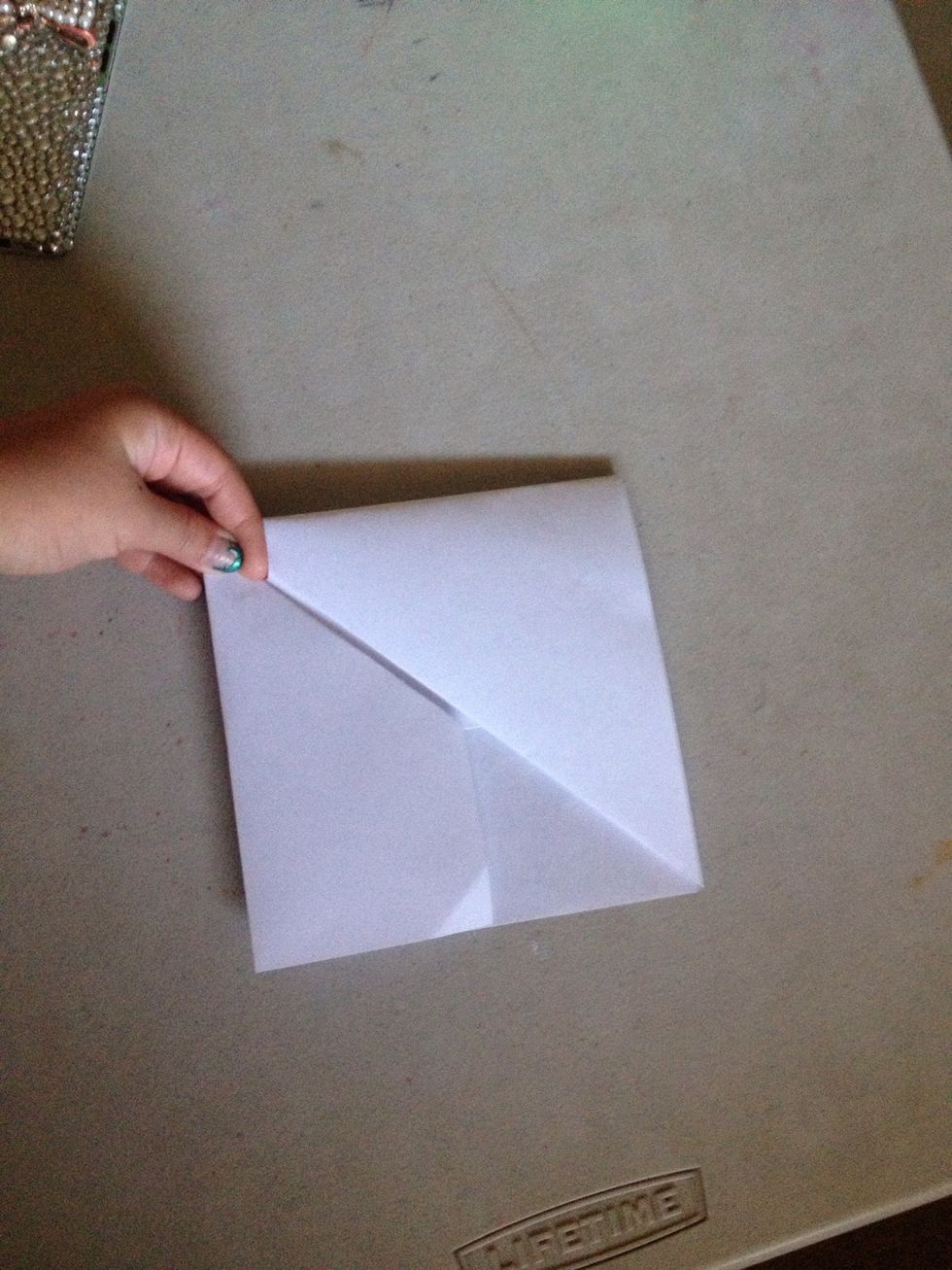 You take the side and folding it in, making a square