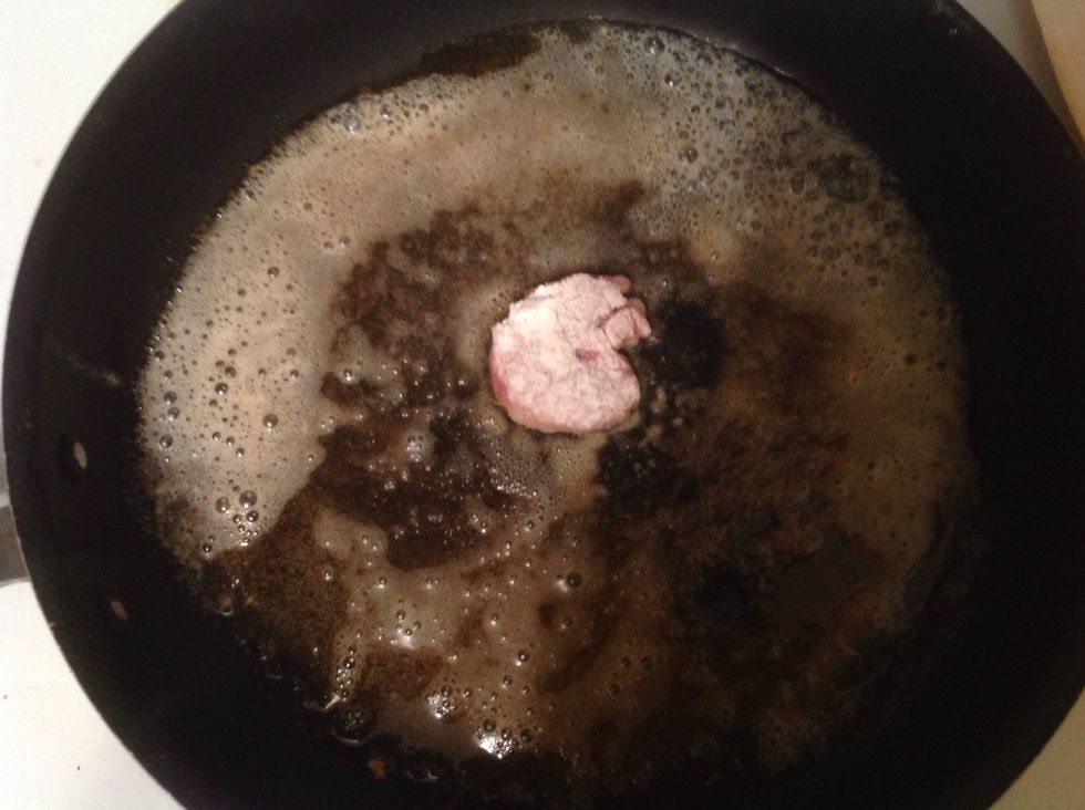 You than take your piece of meat and dip it into the bowl of flour, make sure you get it completely cover in flour