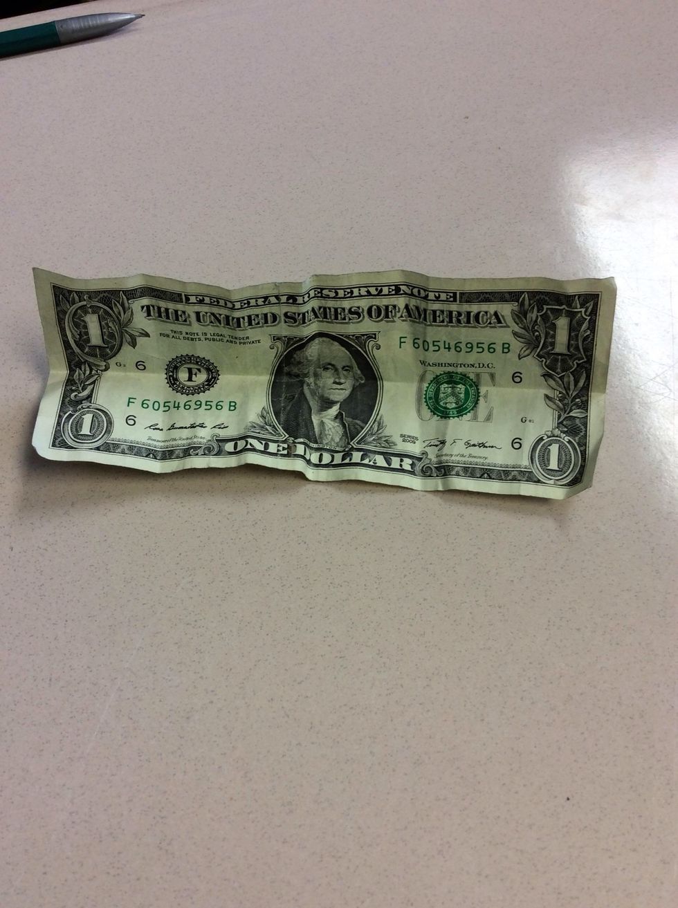 You then fold it down in half, crease it and unfold it.