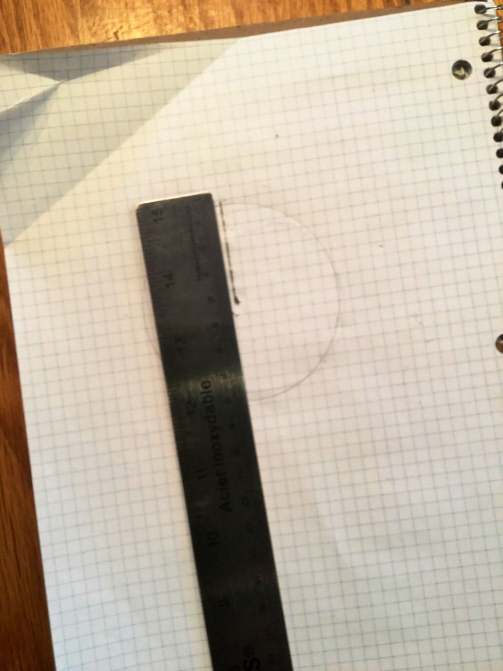 You then must measure the length from the centre of the circle to the edge with a ruler.