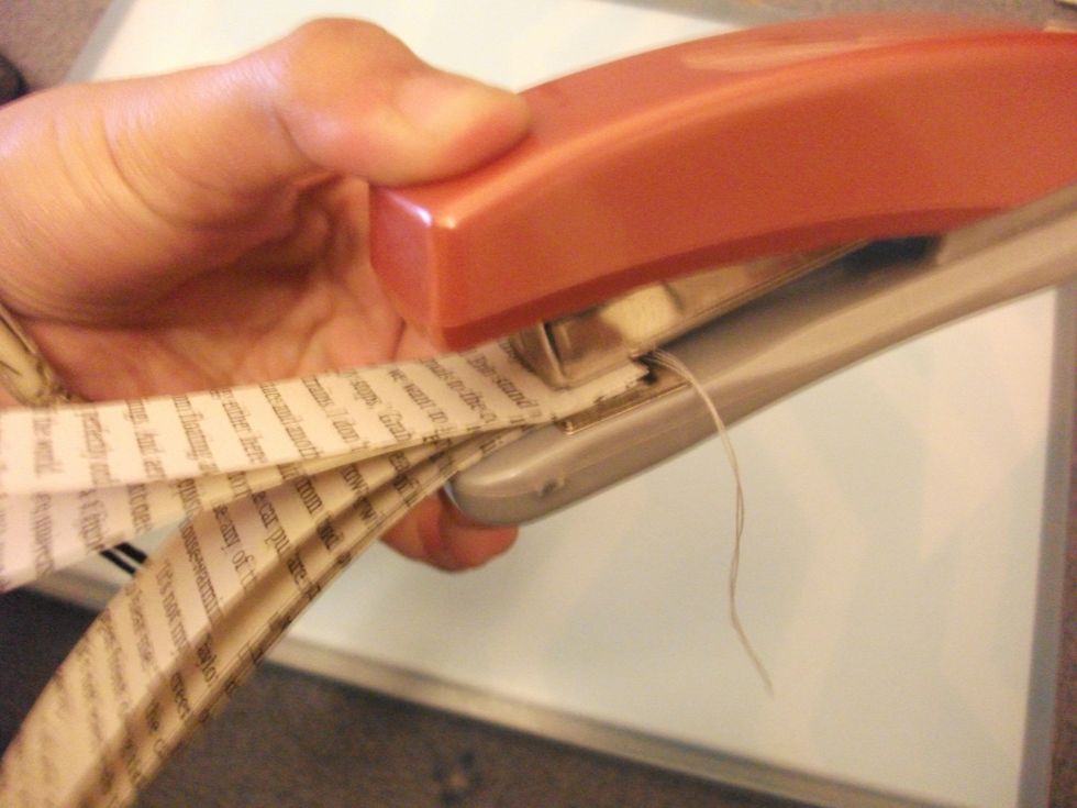 You then staple the top bit, so everything stays in place. I would say staple about 1/2 - 1 cm in so it's sturdier and the thread is less likely to pop out.