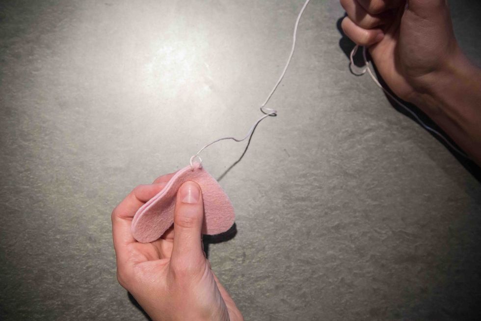 You've completed your first blanket stitch! Make sure to pull the stitch tight.