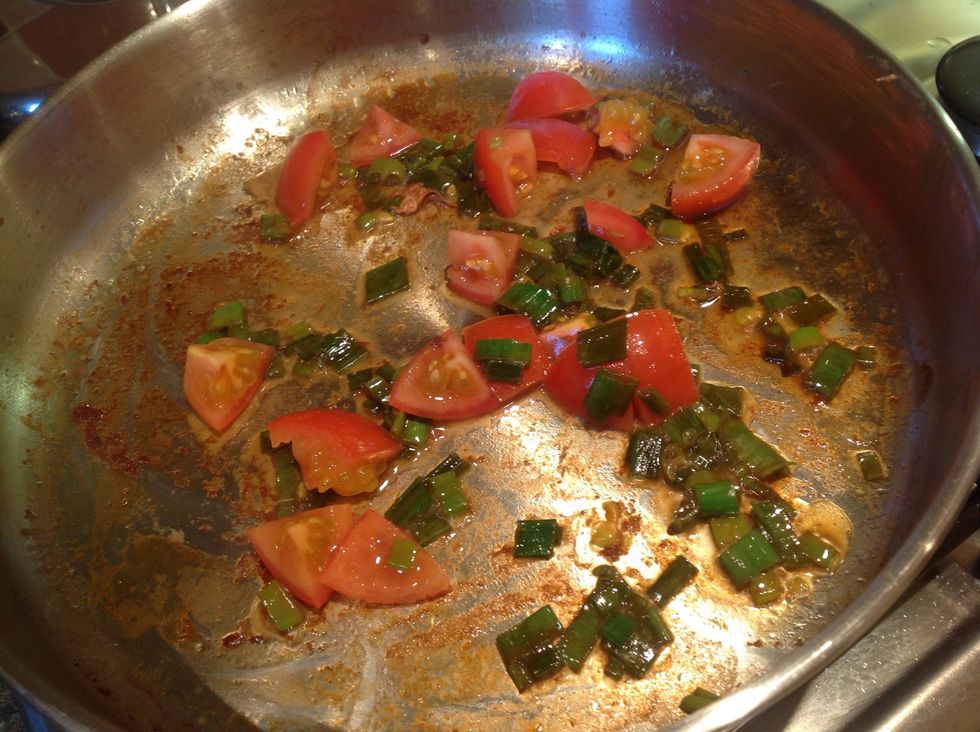 You've probably started to notice the bacon gunk is coming off the pan now. Yay! Add the tomatoes and saut\u00e9 for 1 minute.
