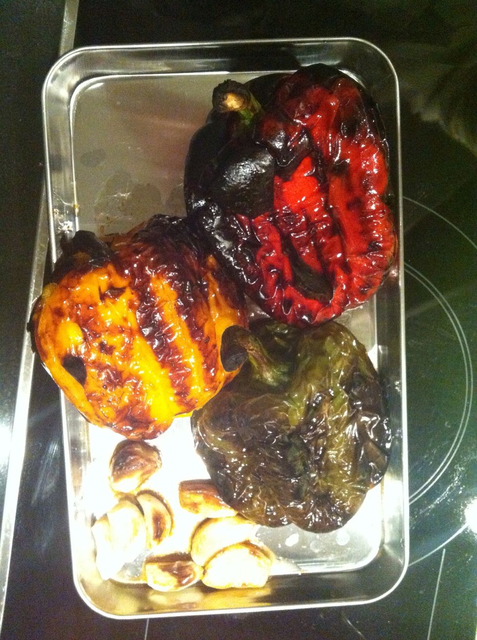 You want them to be burnt like this so they're easy to peel cover them with foil to keep them warm if it cool down it will be quite difficult to peel