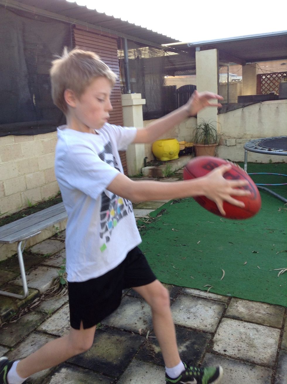 You want to guide the ball down with your proper hand onto your foot.