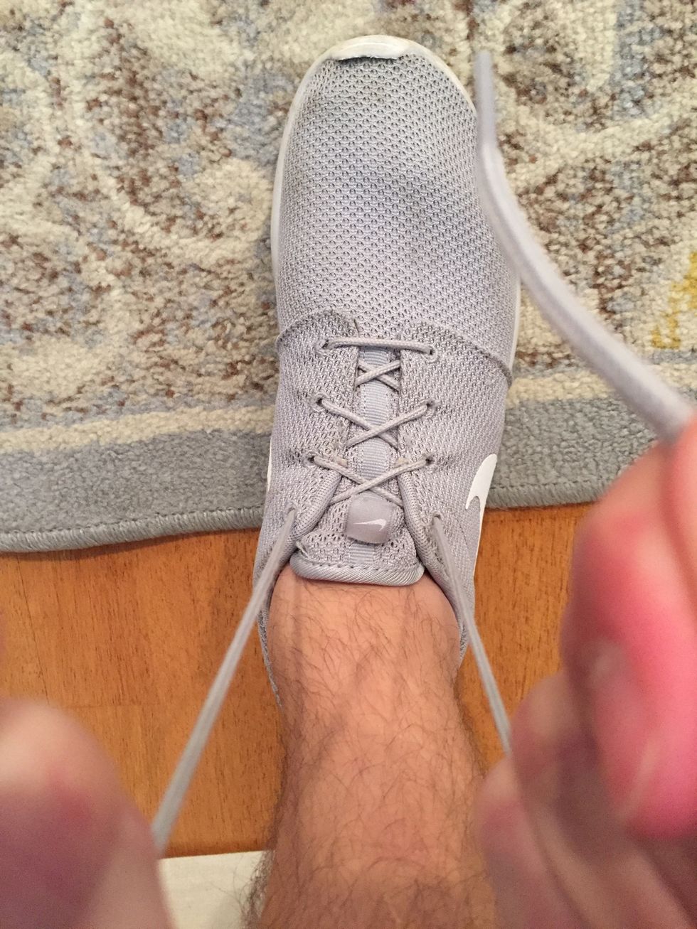 You want to pull these laces directly to you in order to make sure the laces are still tight