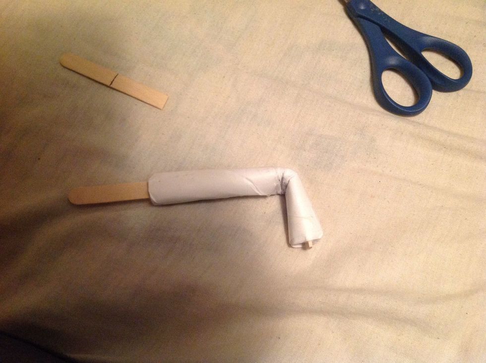 You want to then bend you one popsicle stick like in the picture because that is going to be your bow arm.