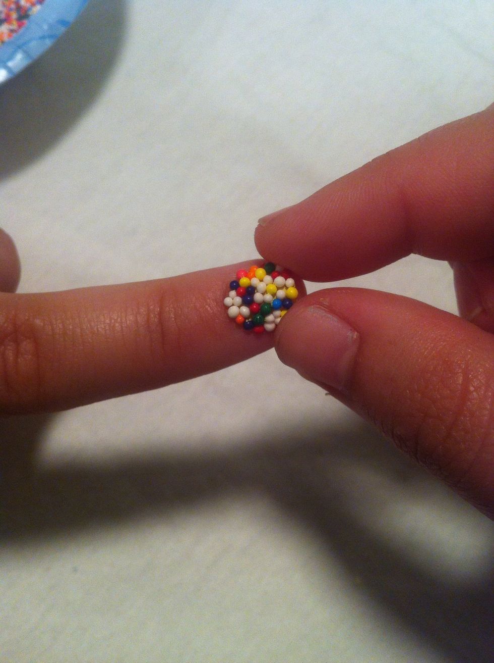 You will be able to feel/see when the polish gets more dry, you can better shape the sprinkles-- be sure to gently push the sprinkles into the polish at this time.