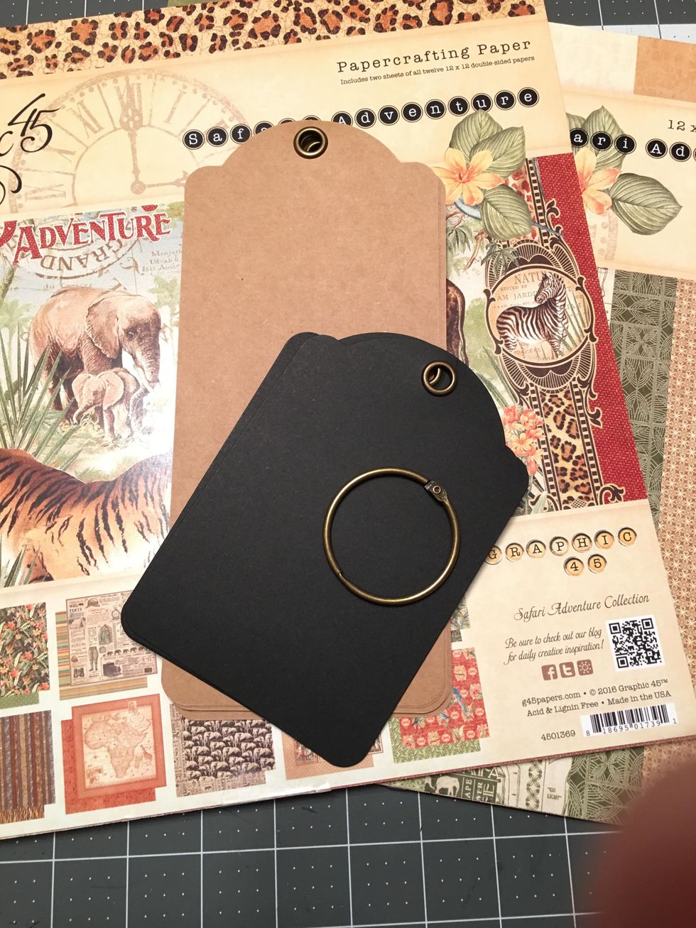 You will create a unique and beautiful tag mini album by combining 6 Graphic 45 Large Kraft Tags and 6 Regular Black Tags onto one large ring that comes with the tag album sets.