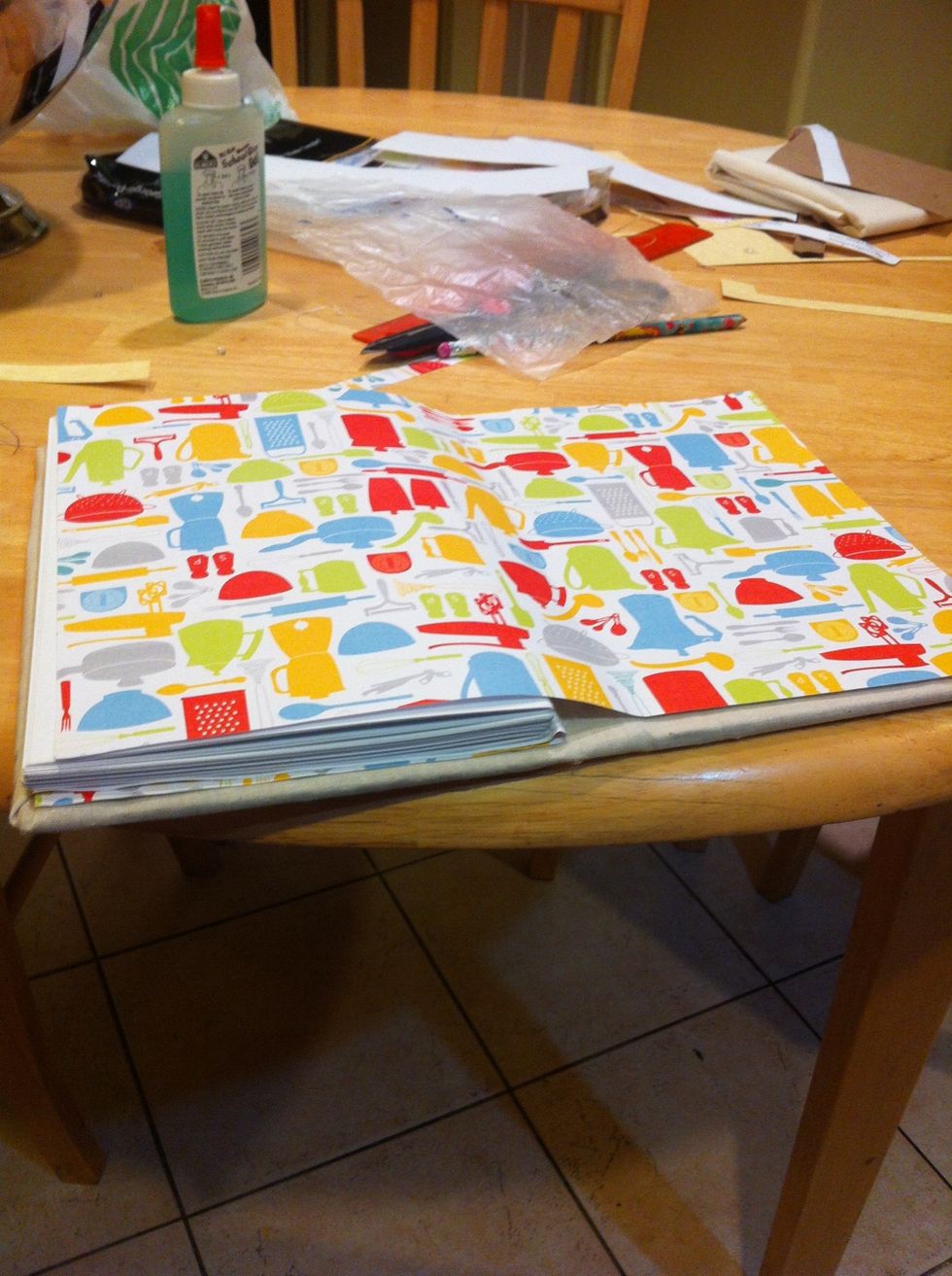 You will glue this to the cardboard and the first page of your book