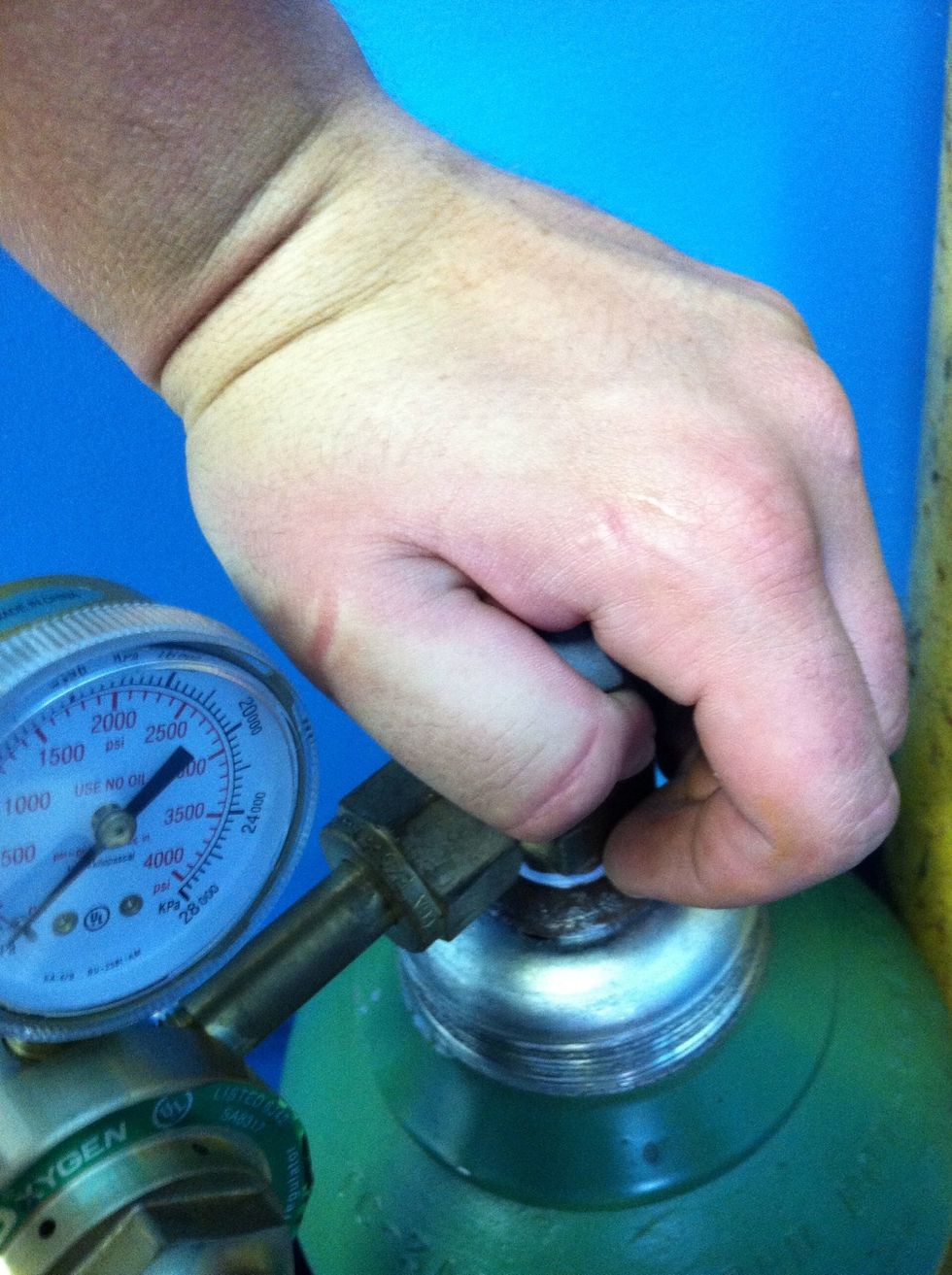 You will hear a little click which will indicate that oxygen has begun flowing. Turning should be easier now.