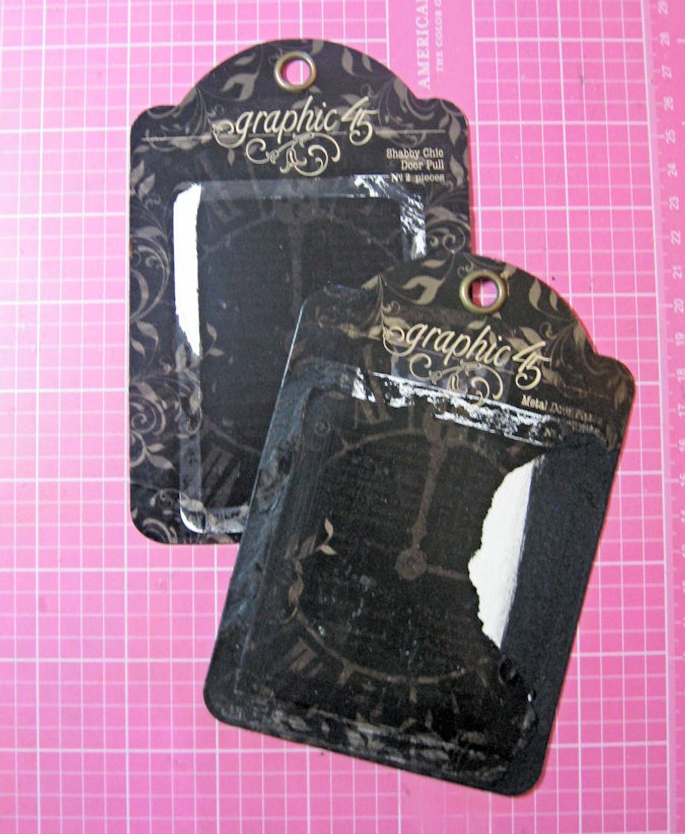 You will need 2 Staples packaging tags. Remove clear plastic cover. Carefully sand off or glue down any loose edges, then paint the edges with black chalk paint. Do this on both sides of each tag.