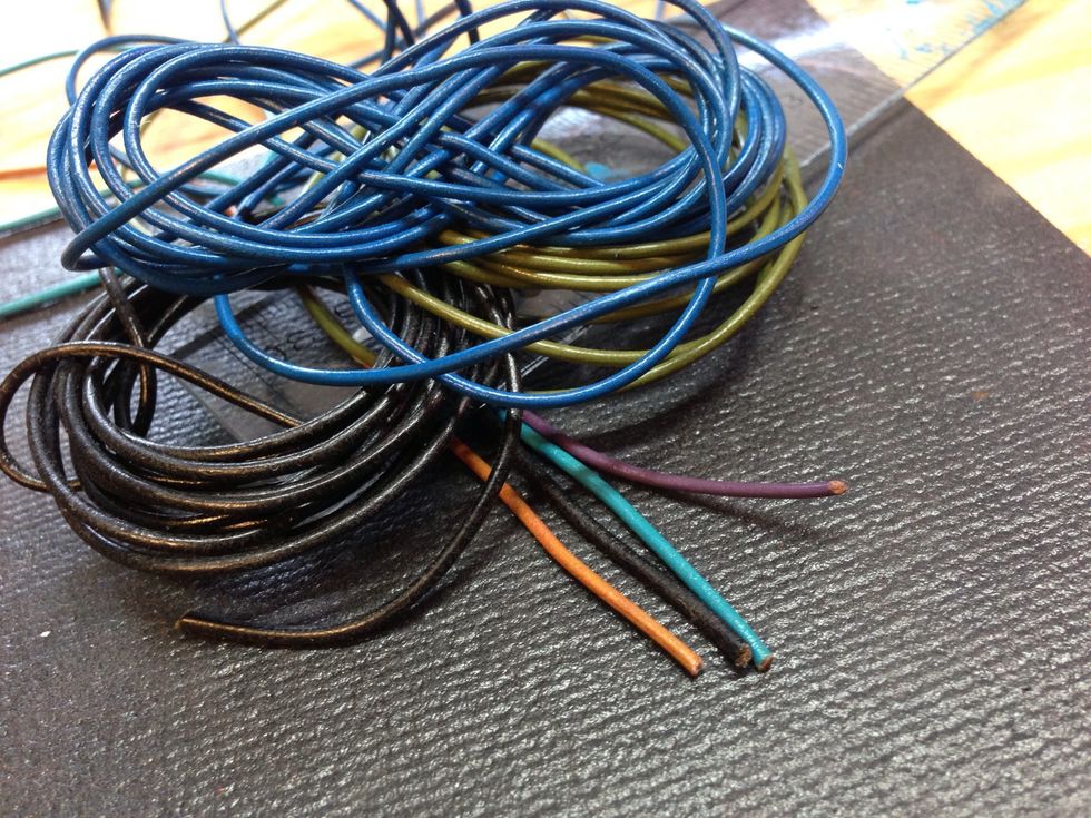 You will need 4 feet of 2mm leather cord, the smooth round kind works well. I'm using some scrap ends from an old purse project, to "use it up!"