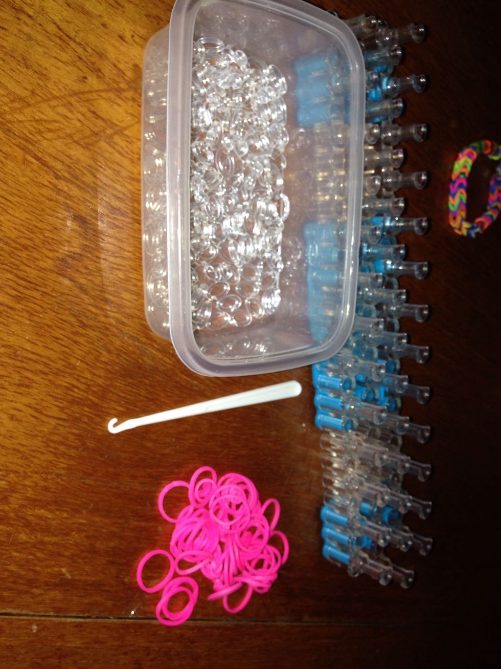 You will need 47 pink bands,1 hook, rainbow loom and s clips.