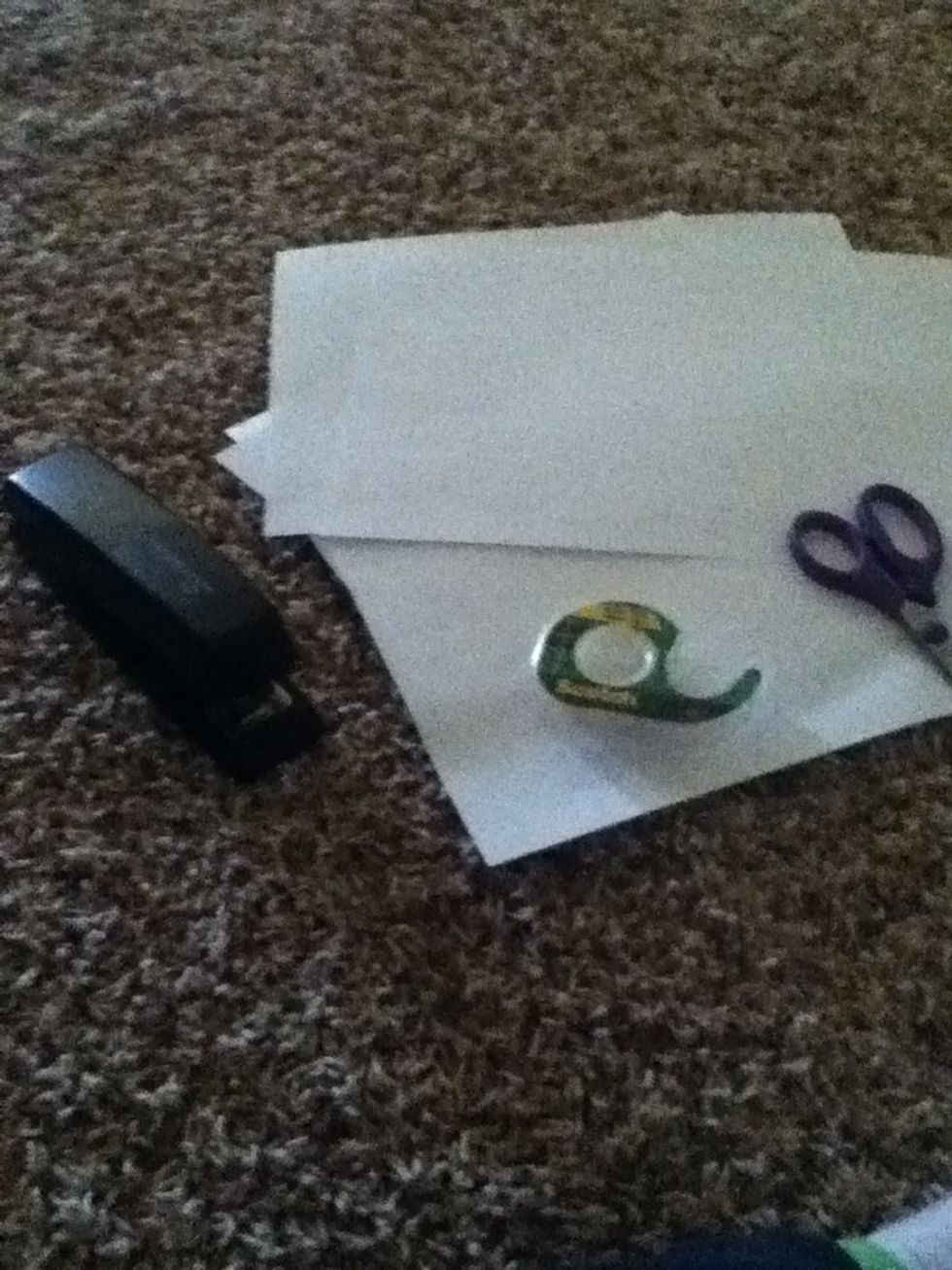 You will need 6 pieces of paper, scissors tape and stapler