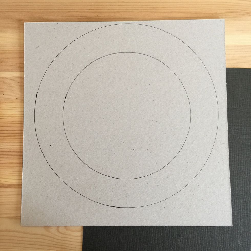 You will need a 12x12 in cardboard, a 12x12 in black cardstock. You can do the circles using dishes!