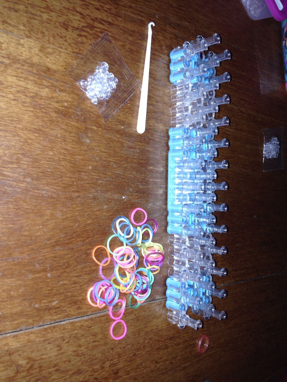 You will need a hook, s clips, loom bands( any colour) and a rainbow loom.