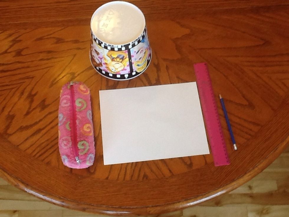 You will need a page, a ruler, a pen or pencil, coloured crayons, a round object, patience and imagination.