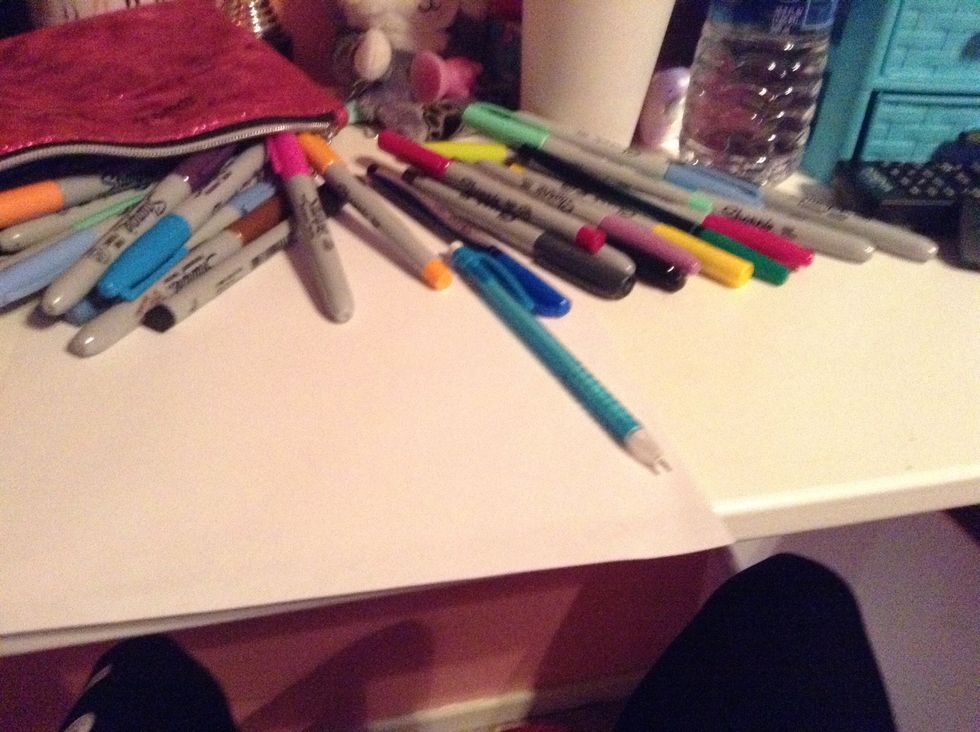 You will need a pencil, a white blank paper, and some colorful markers.