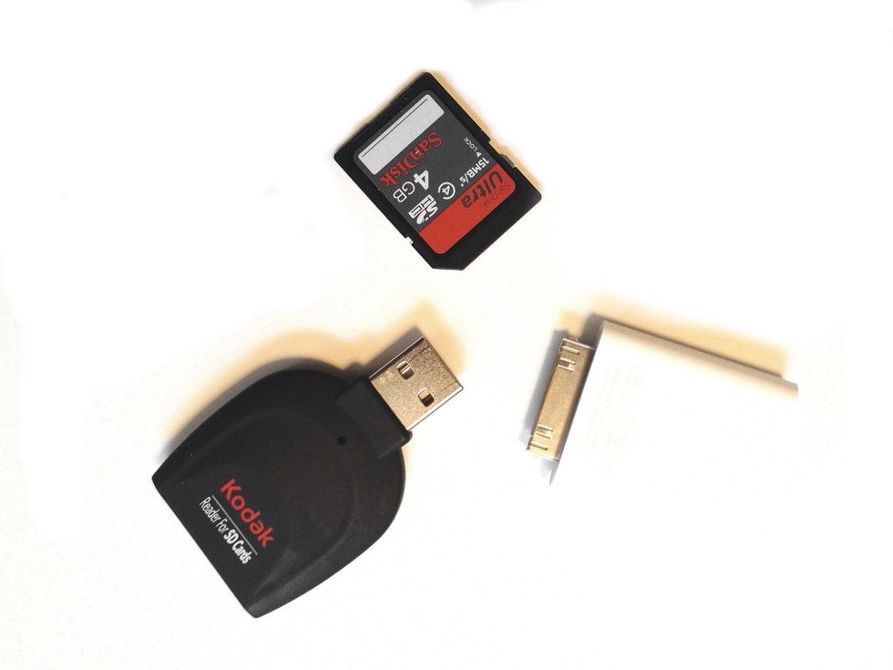You will need a SD Card Reader with USB like this one by Kodak. You will also need a SD Card and an Apple Camera Connection Kit.