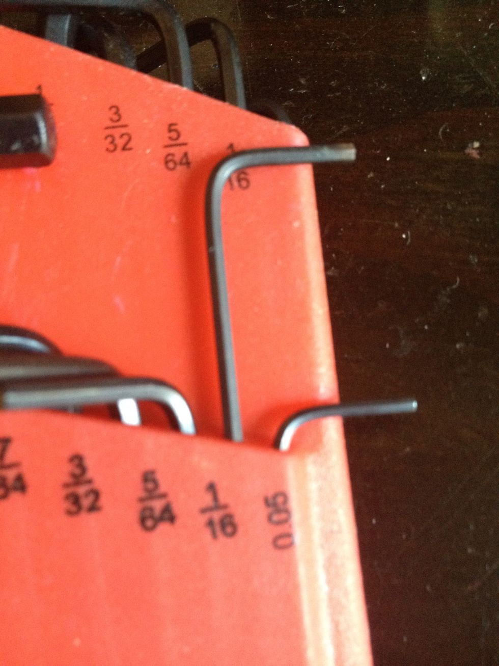You will need a small hex key or Allen key/wrench. On my lock it is a 1/16" head, but I've heard that others are 5/64". I got this set from Harbor Freight for $8.