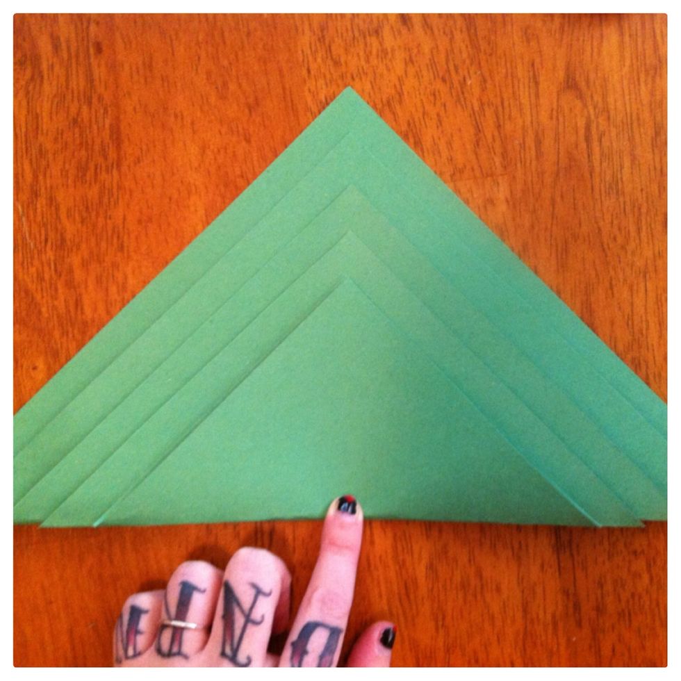 You will need a square of paper for each level of tree an inch apart in size). I used 5 (9, 8, 7, 6, 5 inches). Plus one square for the trunk that is same size as largest square in tree (9" for mine).