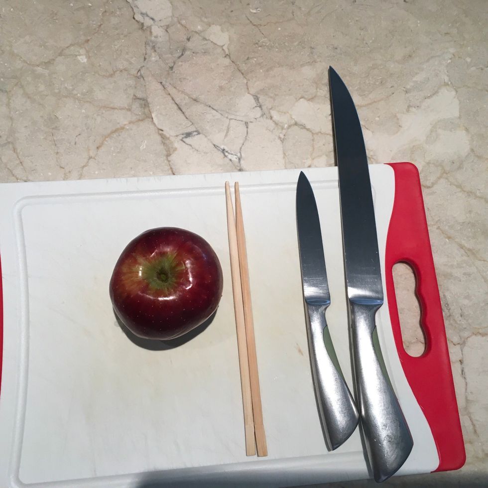 You will need an apple, knives , chopsticks and a chopping board