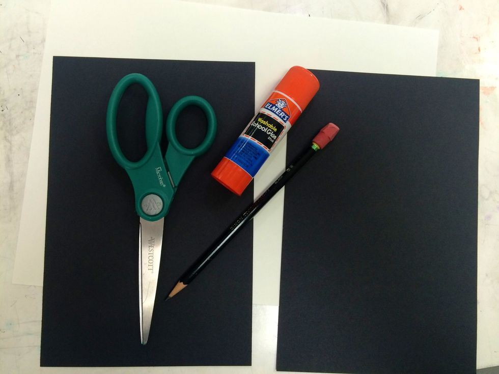 You will need large white paper, a couple pieces of black paper half the size of the white paper, Scissors, glue, a pencil, and scrap paper.