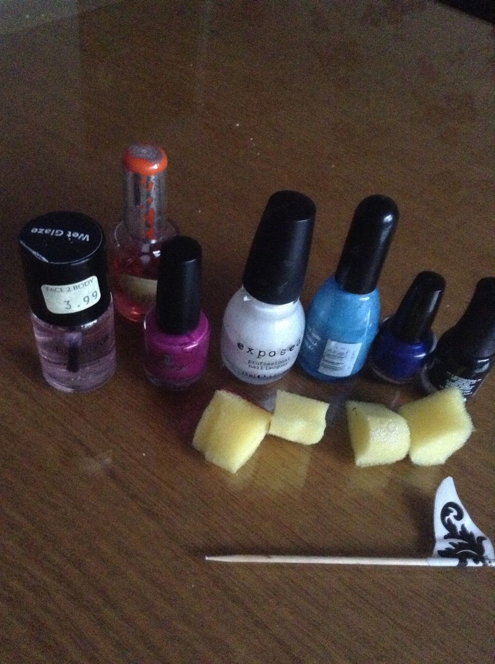 You will need: -Nail polish: Dark and light blue, white/silver, black and purple (base and top coat too) -Four sponges -Toothpick