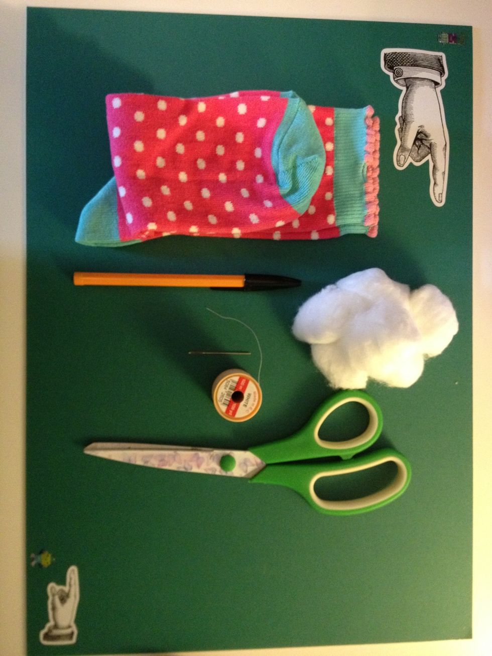 You will need, needle, thread, scissors, cotton wool (approx half a bag per monkey), socks and a pen.