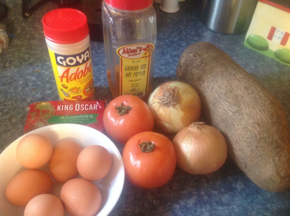 You will need one or two onions, one or two tomatoes ( depending on size), sardines, we prefer in olive oil, 4-6 eggs, red pepper to taste and adobo and a medium size African yam