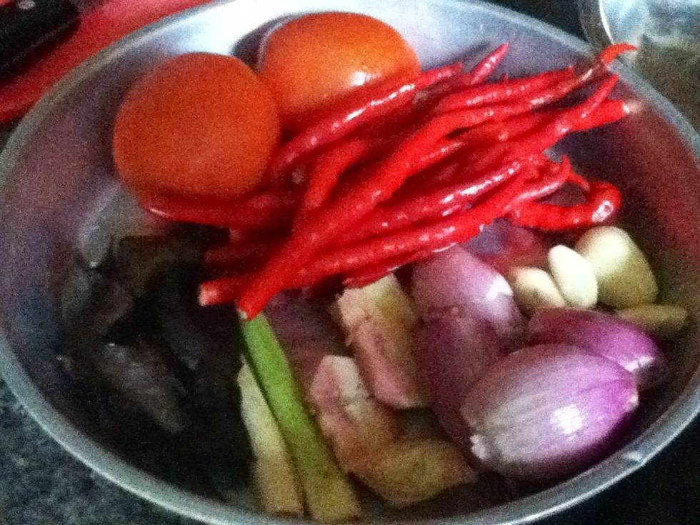 you will need red onion,garlic,galangal,lemongrass,bay, tomatoes and chili