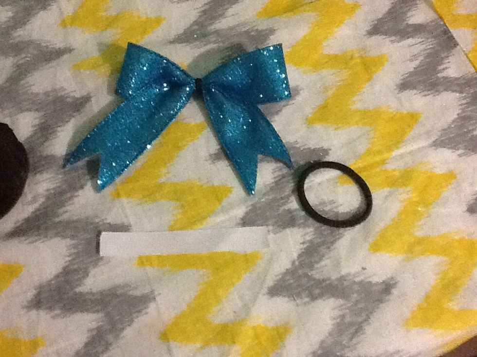 You will need the following supplies to finish the bow *hair tie *Skinny white ribbon * and the hot glue gun be sure to get help from your parents to do the hot glue gun step