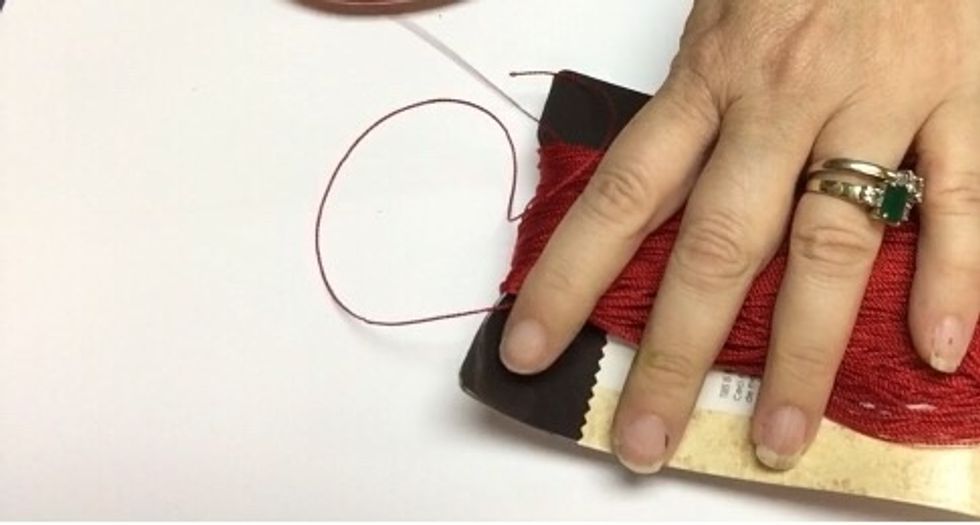 You will need to add a piece of thread to the top portion yo secure all the threads in one knot