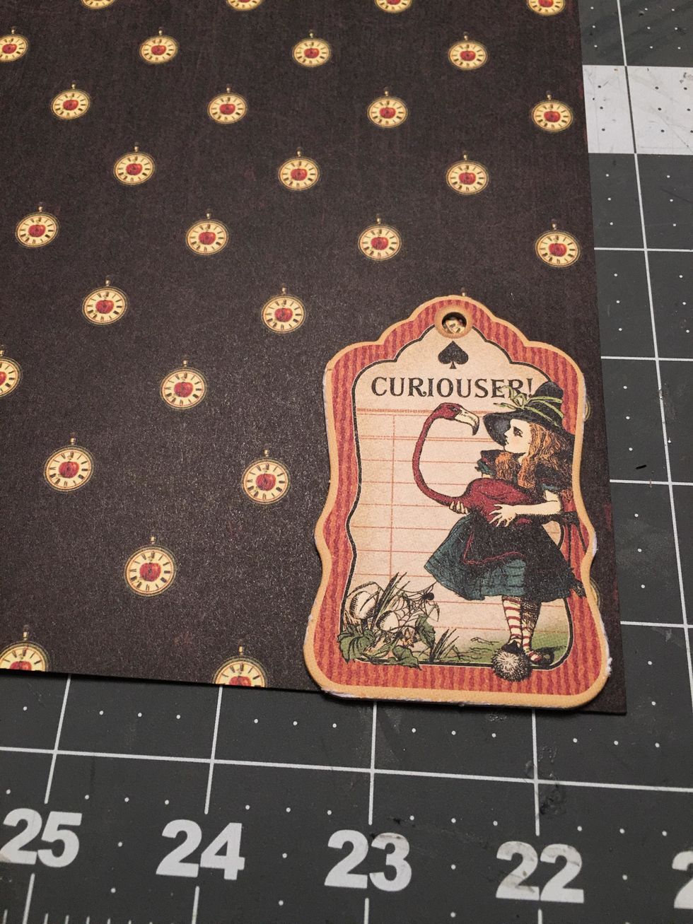 You will need to add patterned paper to the backs of tags that you want to add to the album ring. Glue the tag to the wrong side of the paper.