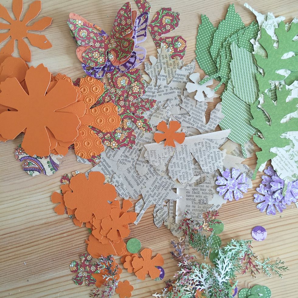 You will need to punch a lot of flowers, leaves and butterflies from different papers, also old book pages.