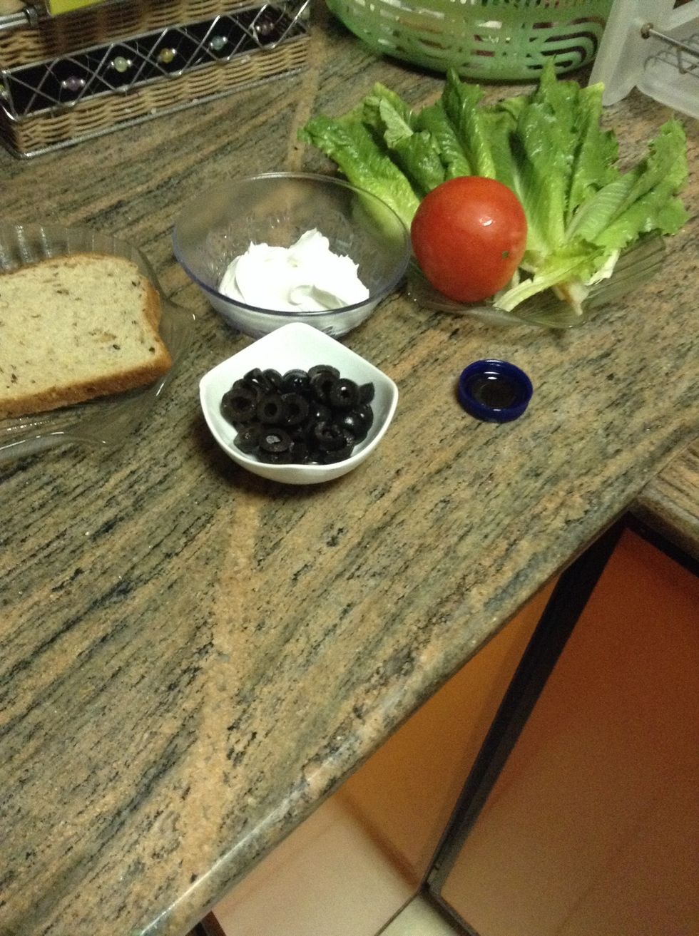 You will need tomato mainly , lettuce , labaneh ( strained yogurt ) ,toast , olive oil , and olives .