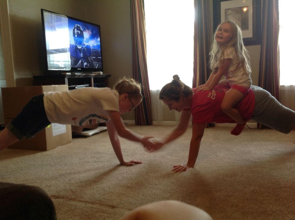 You will notice that my back is not flat on the plank 5's. it is super difficult to keep your core engaged and a flat back with a 4 year old playing rodeo.. But it's a great workout!