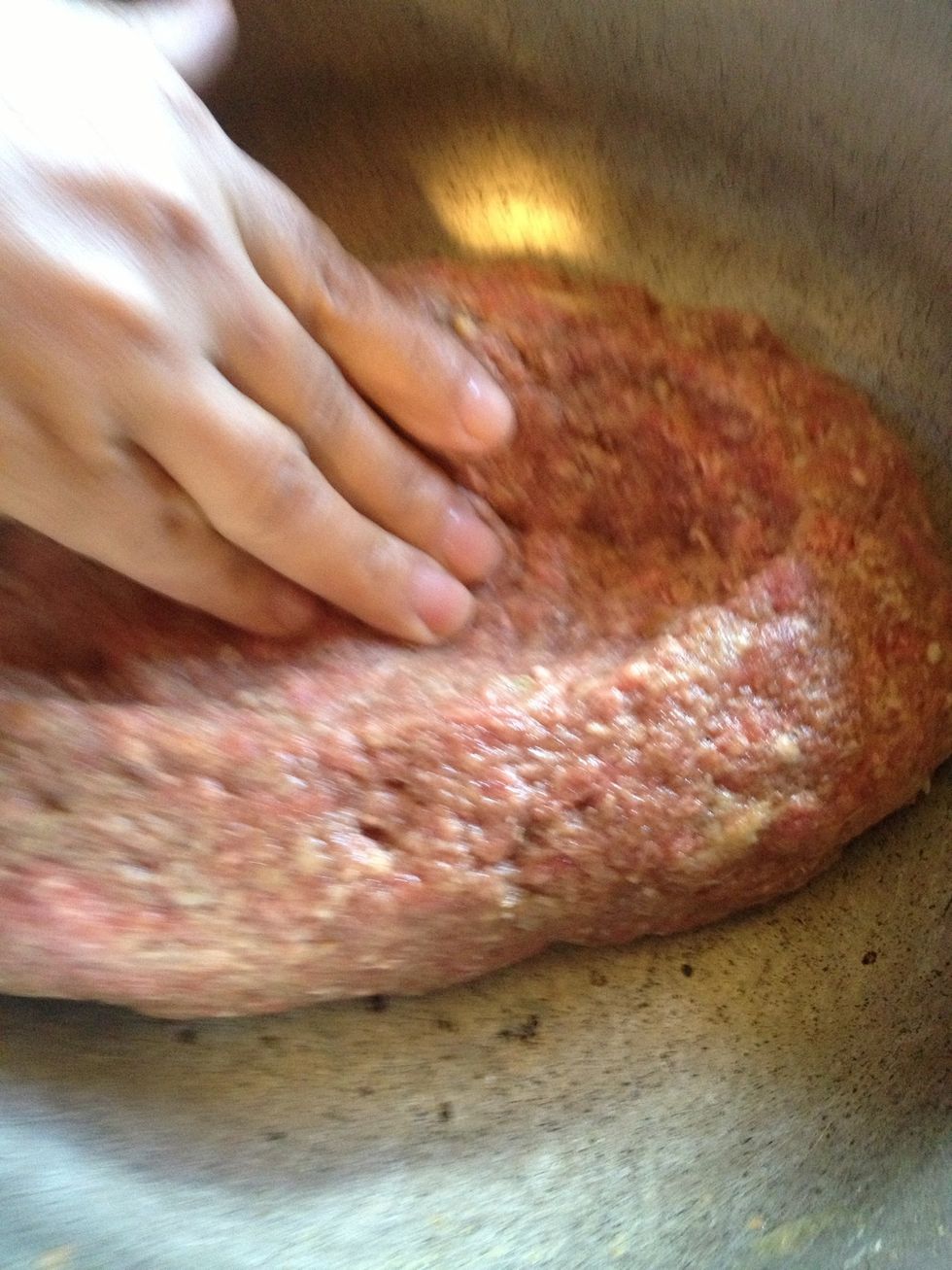 You will now need a pot in which you will add the meatloaf mixture. We will free-form the meatloaf. While free forming into a rectangle we will make an indentation lge enough to fit 2 hard boiled eggs