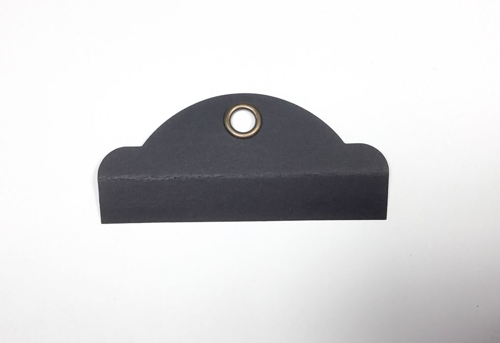 You will now need the tops of the tags. Measure 2.5cm from the top of the tag and fold as shown.