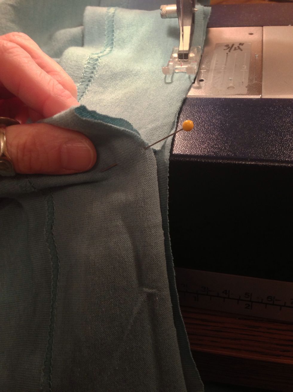 You will probably have a little extra hem. Pin the excess to mark the correct length. Break your threads.