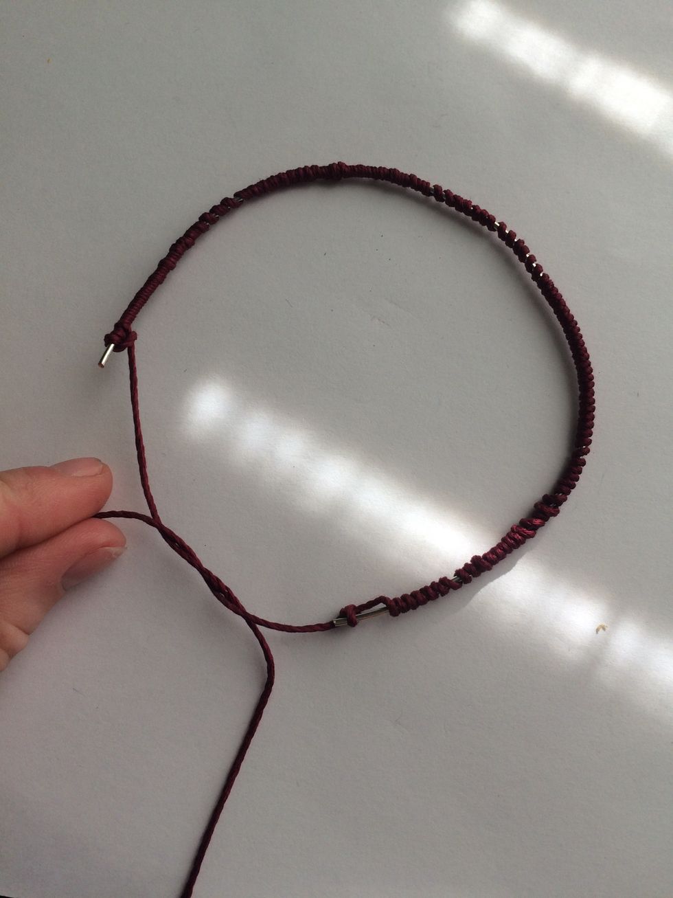 Your almost done! Just cross cross and tie off each end of the string.