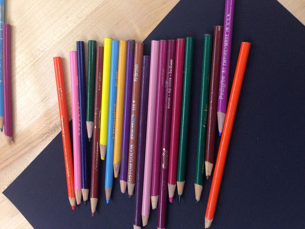 Your average Crayola colored pencils. They work on any type of paper. Colors can be vivid depending on the amount of pressure you use. They blend ok but are inexpensive and easy to use.